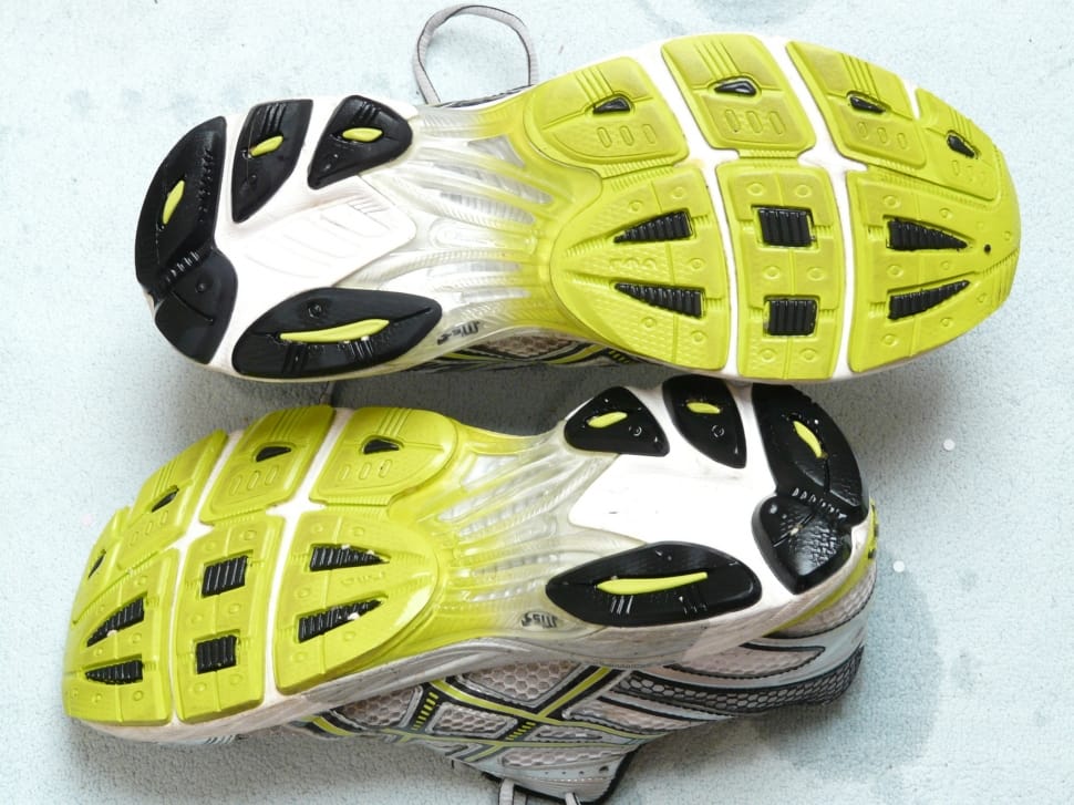 grey white and yellow running shoes preview