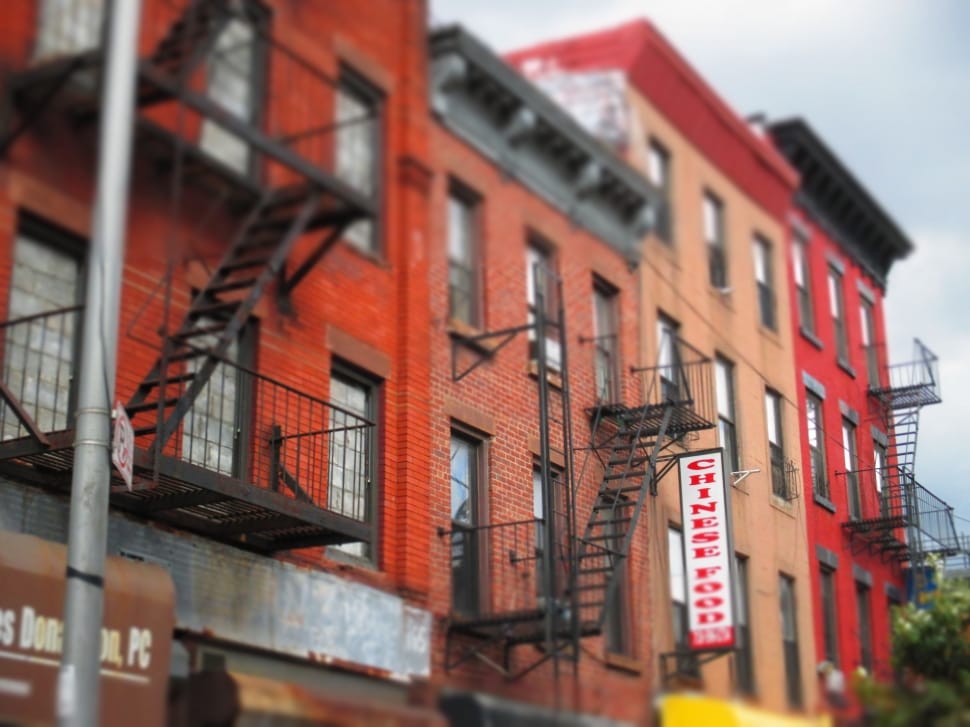 red concrete buildings during daytime preview