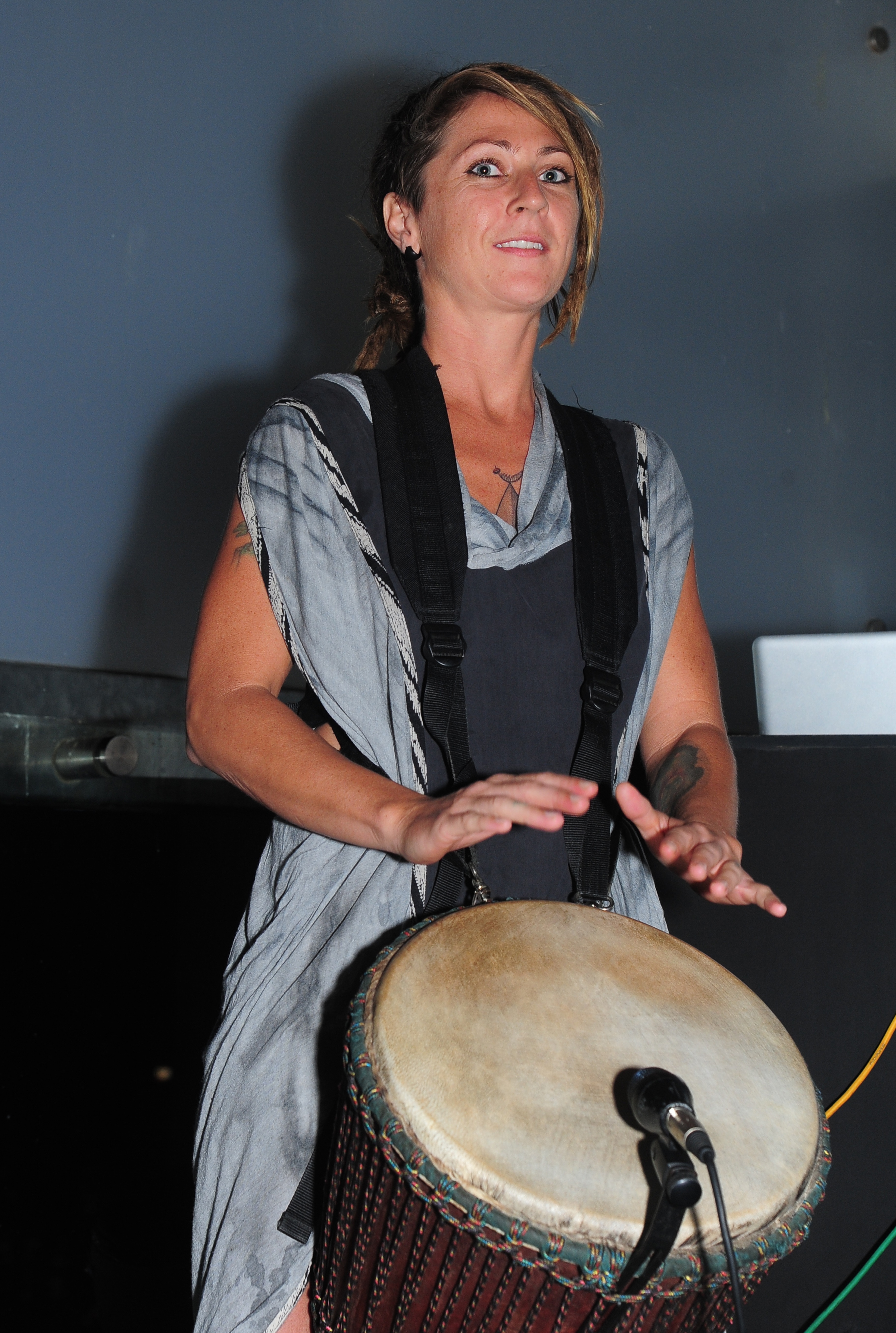 women's gray and black dress and brown drum