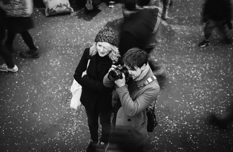 grayscale aerial photography of two person standing near to each other preview