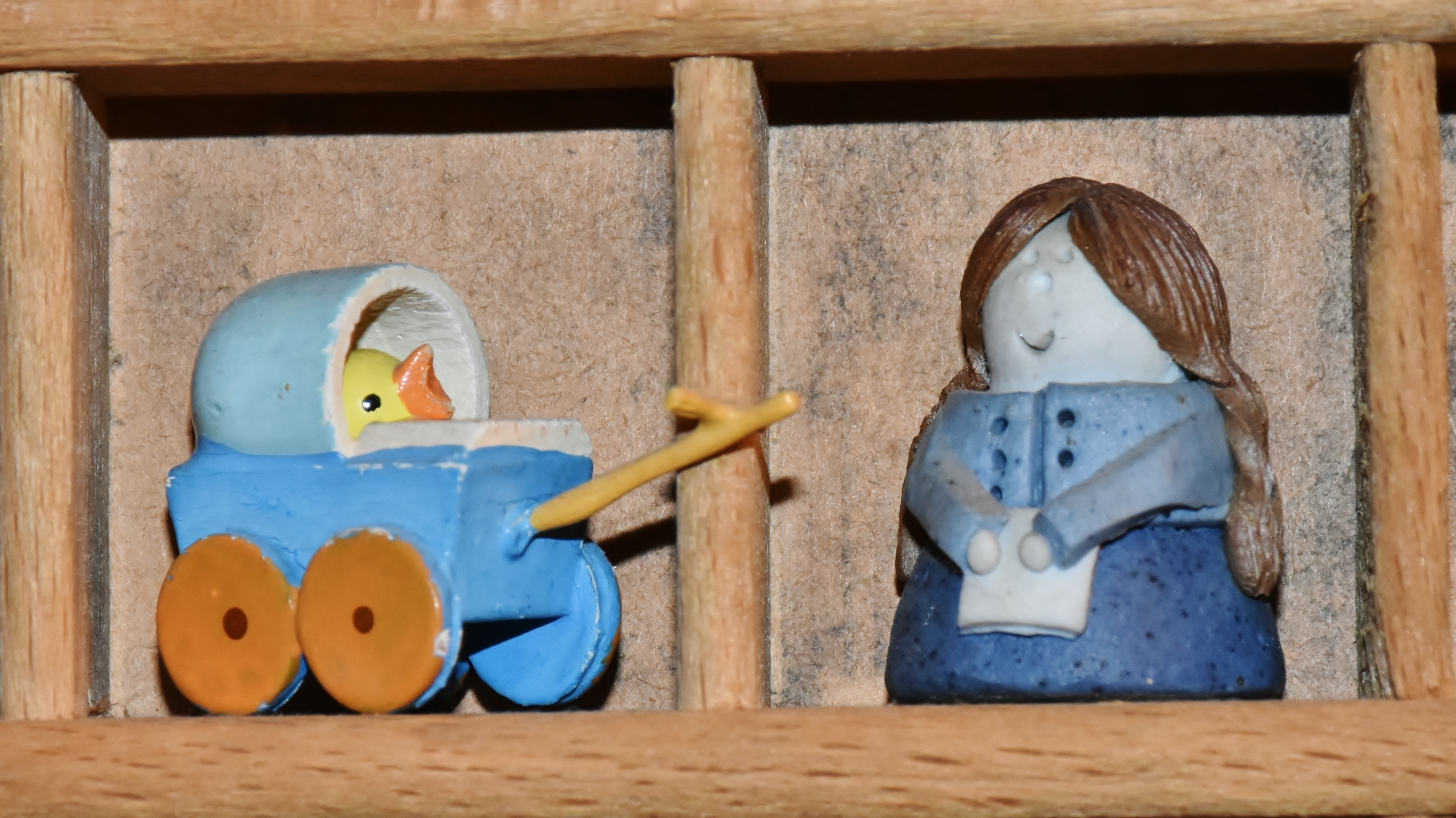blue duck and woman figurines