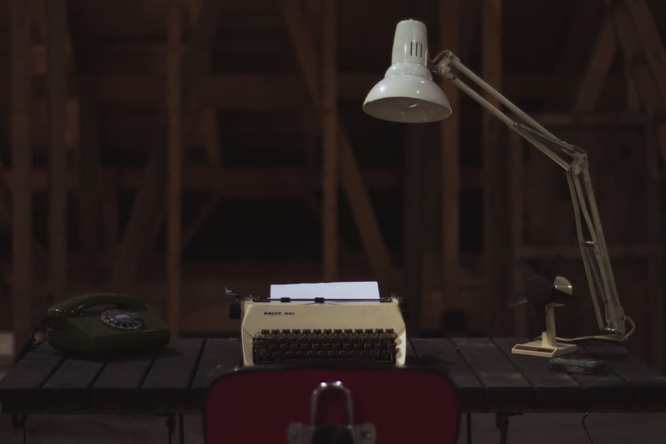 study lamp near typewriter on top table preview