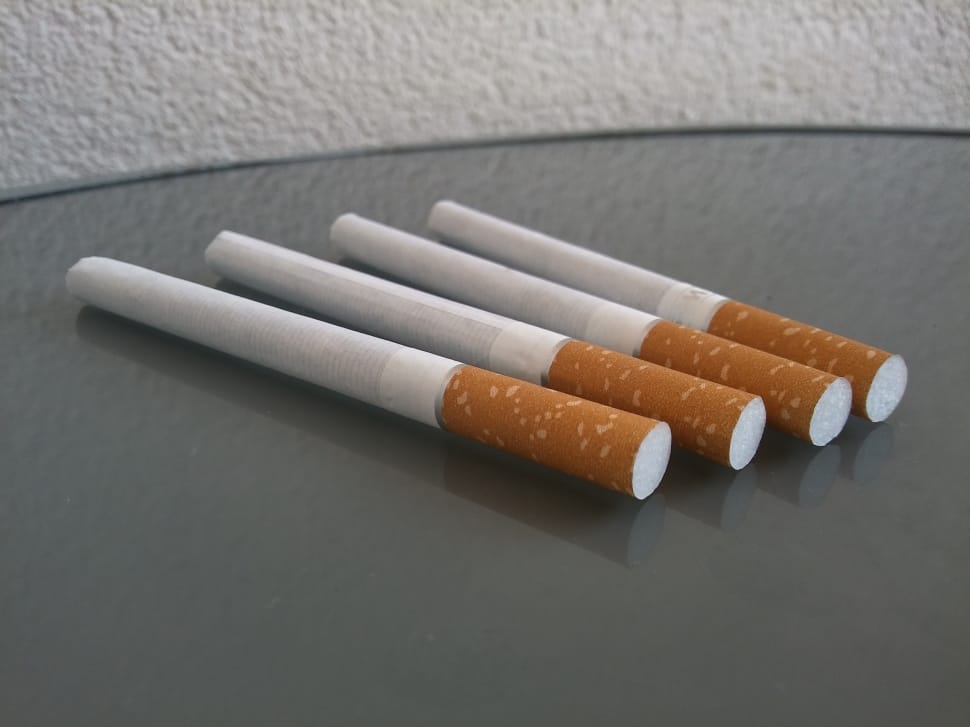 4 orange and white cigarette sticks preview