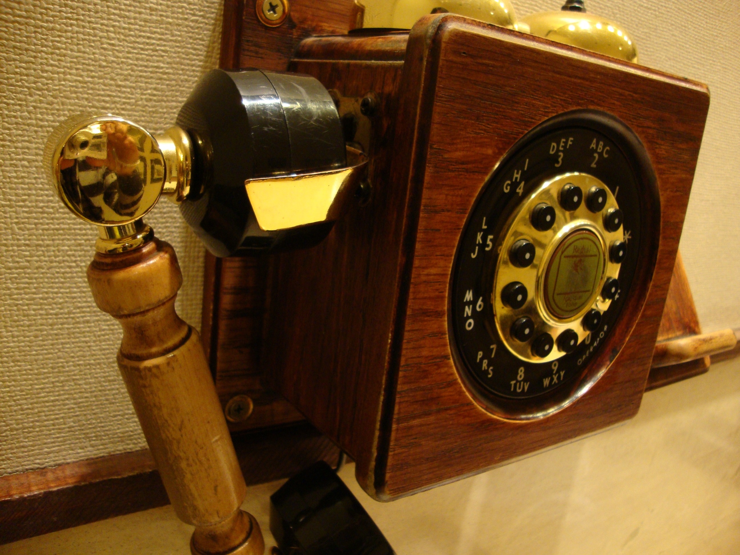 brown and black cradle telephone