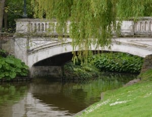 grey bridge on river during daytime thumbnail