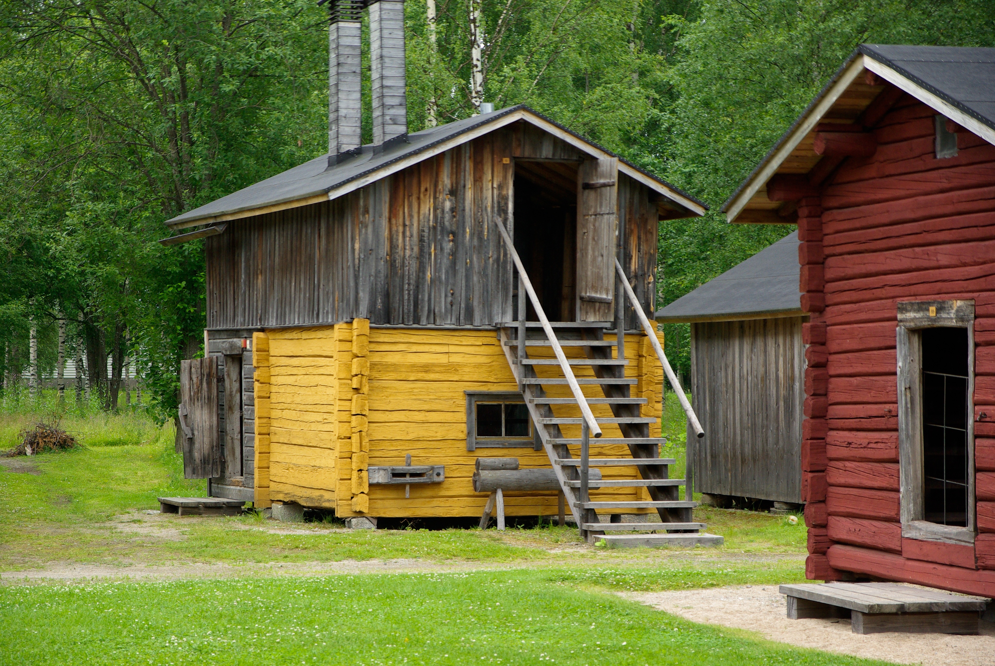 yellow and brown wood storage house with stairs
