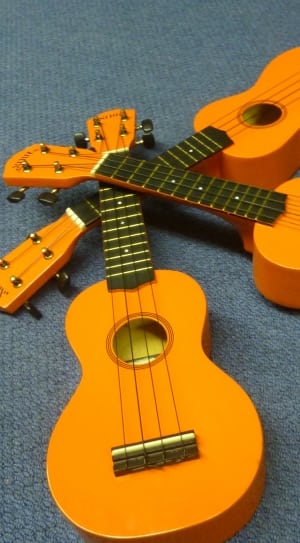 3 brown and black ukuleles thumbnail