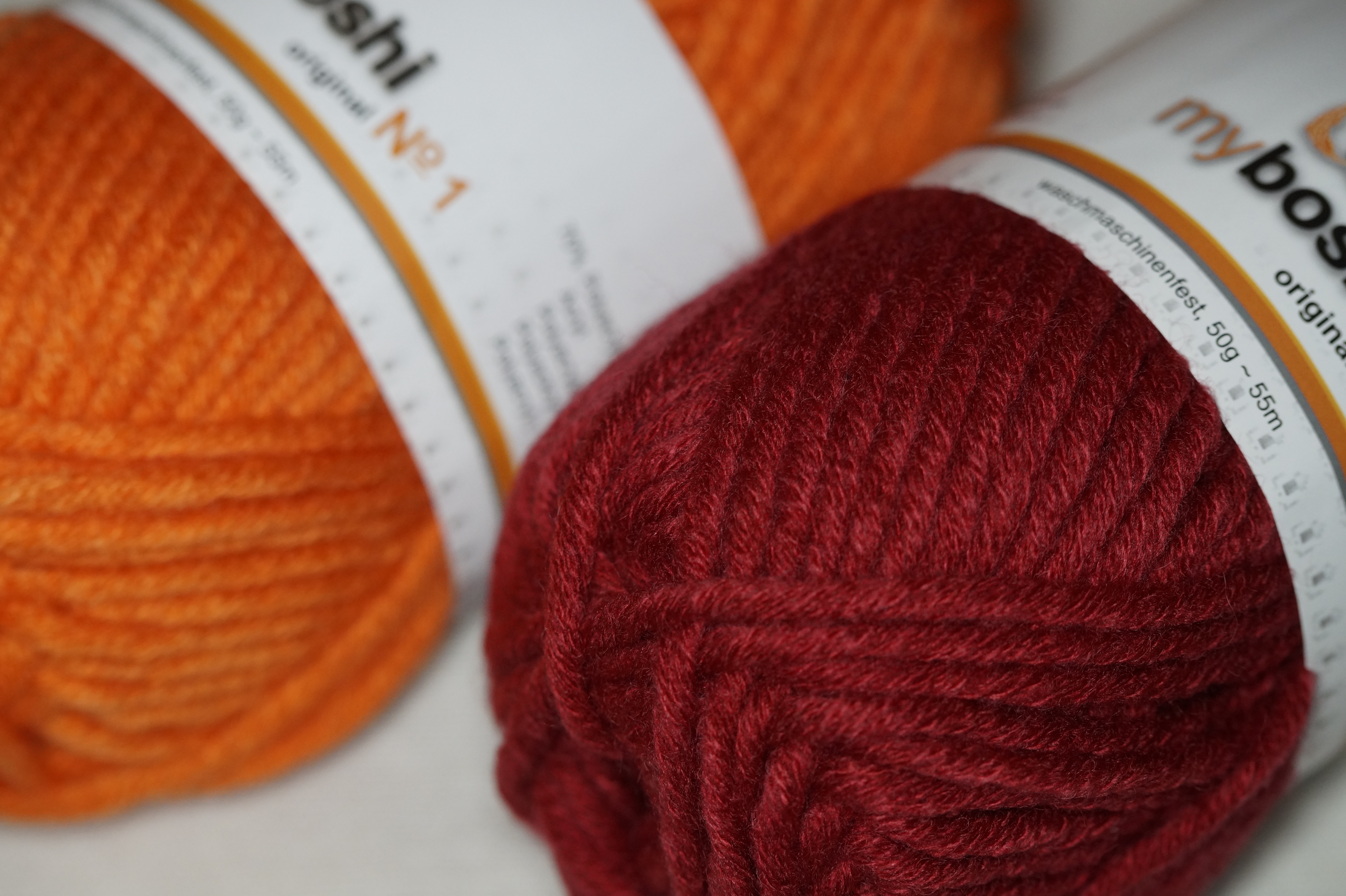 orange and red yarn spool