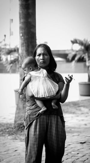 grayscale photography of woman and baby thumbnail