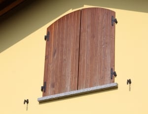 photo of brown wooden window near white wall thumbnail