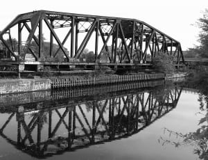 grayscale photo of metal bridge thumbnail