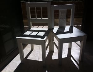 2 white wooden chairs thumbnail