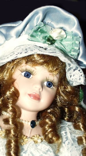 brown haired girl ceramic doll thumbnail