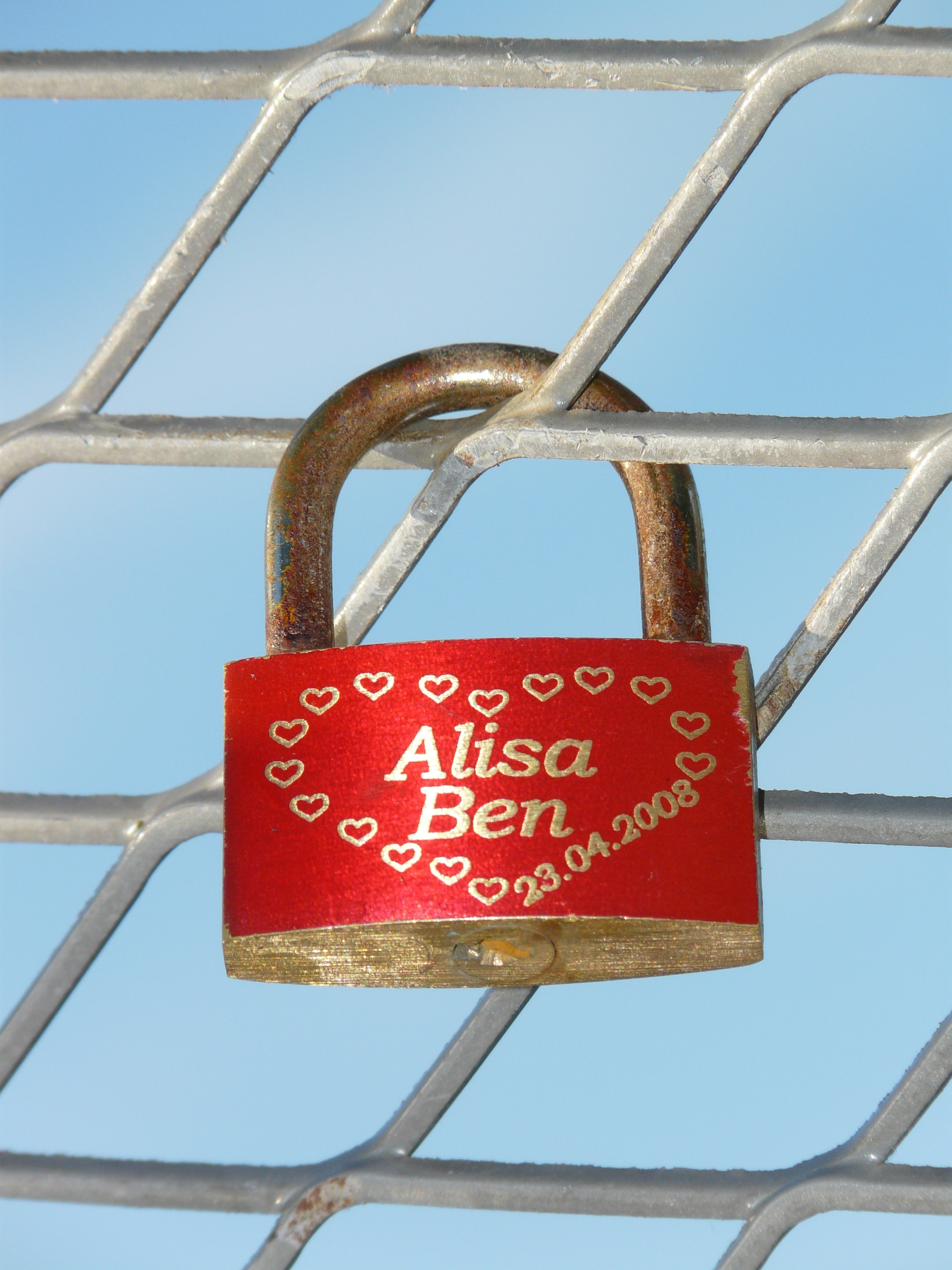 red and brass padlock