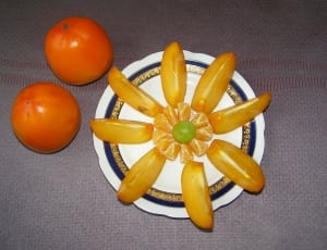 two orange round fruits thumbnail