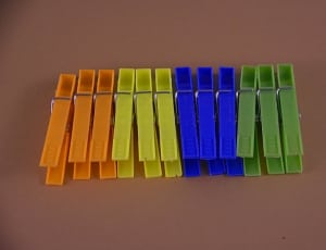 orange yellow blue and green plastic clothes pin thumbnail