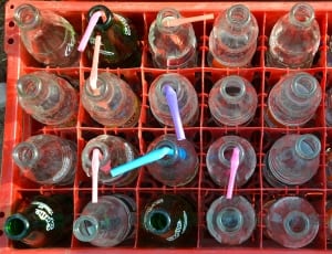glass bottles with straws and red plastic crate thumbnail