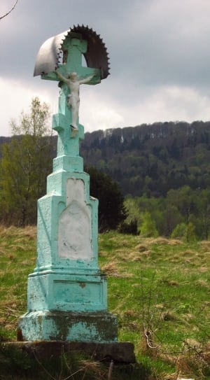 teal and white crucifix statue thumbnail