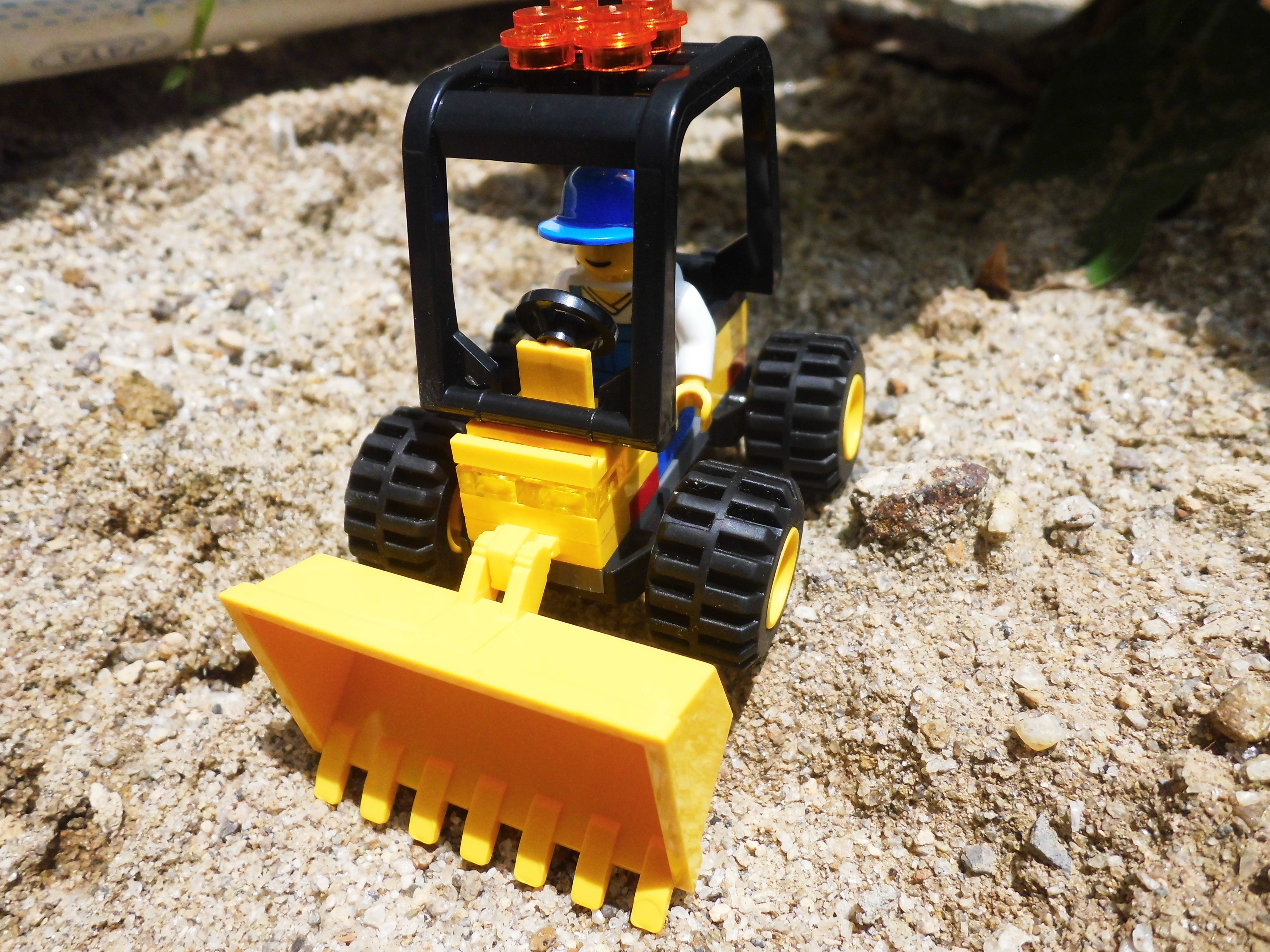 black and yellow front loader lego toy