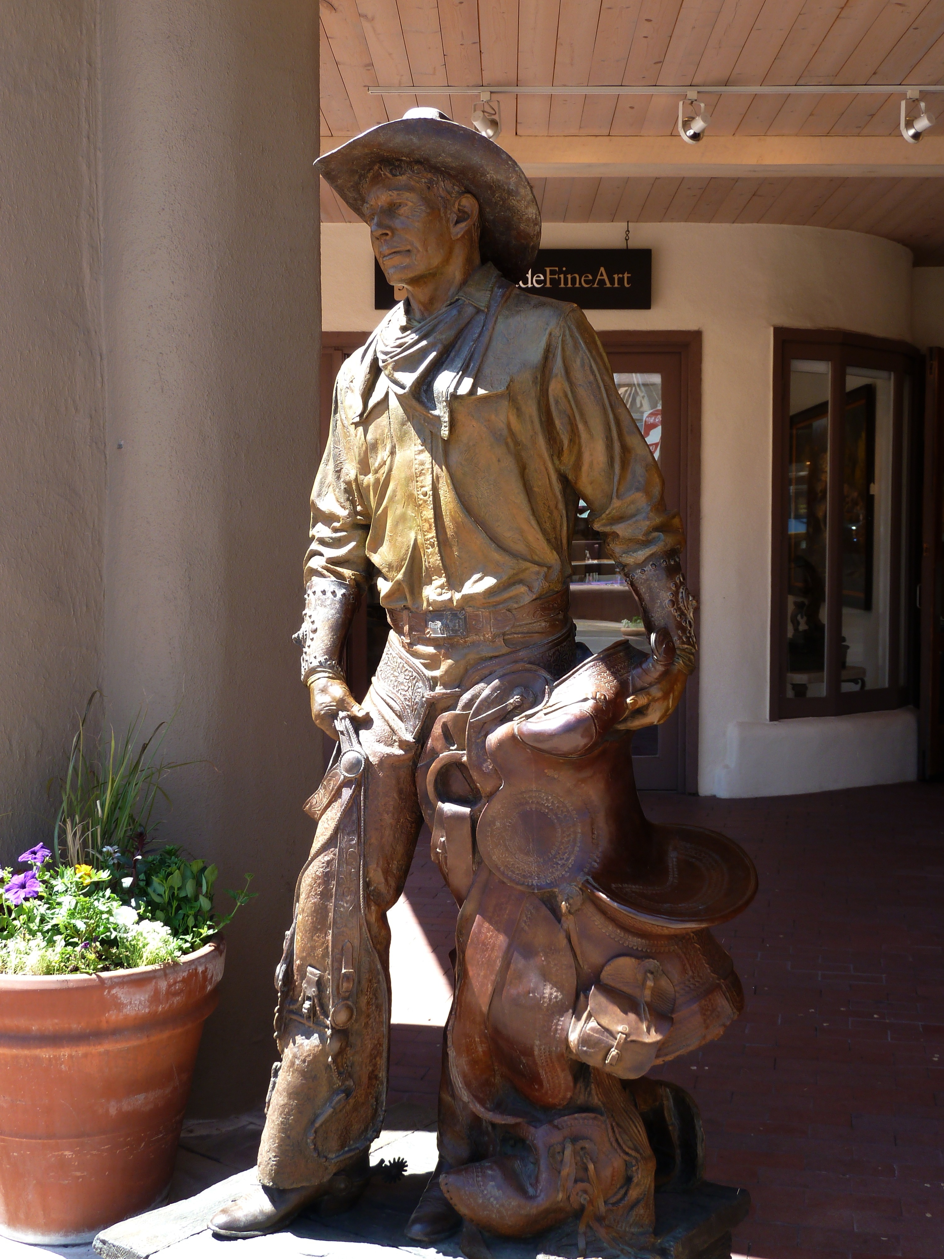 man in brown hat figurine