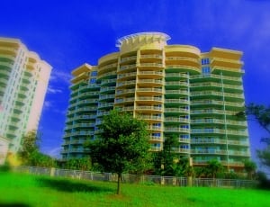 beige and green concrete buildings thumbnail