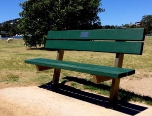 green wooden outdoor bench thumbnail