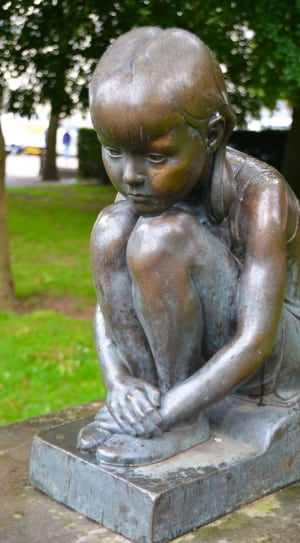 child sitting figurine thumbnail
