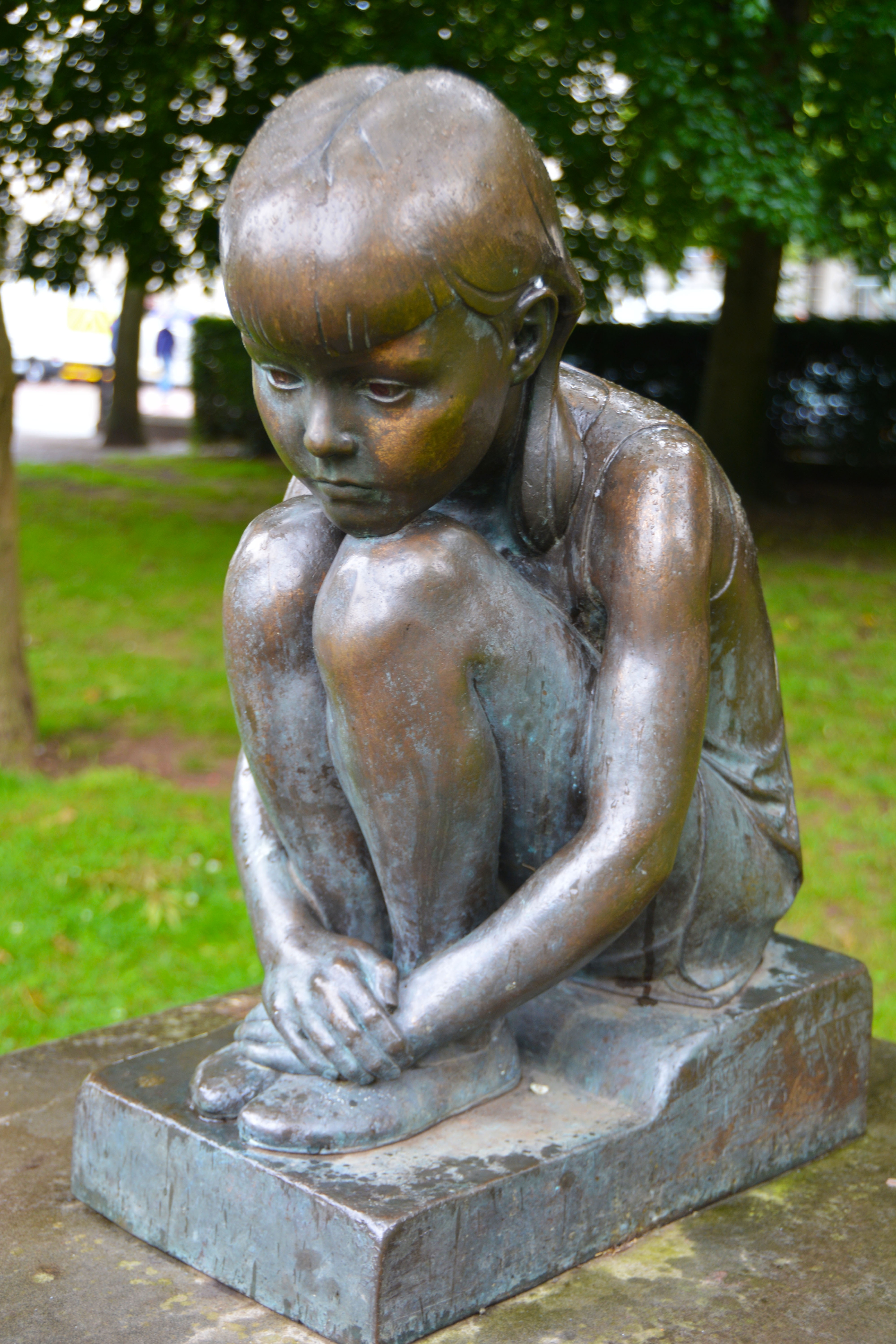 child sitting figurine