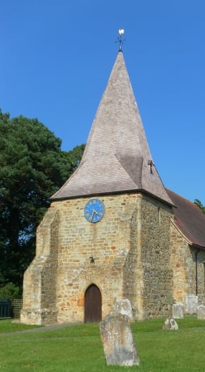brown brick church with clock thumbnail