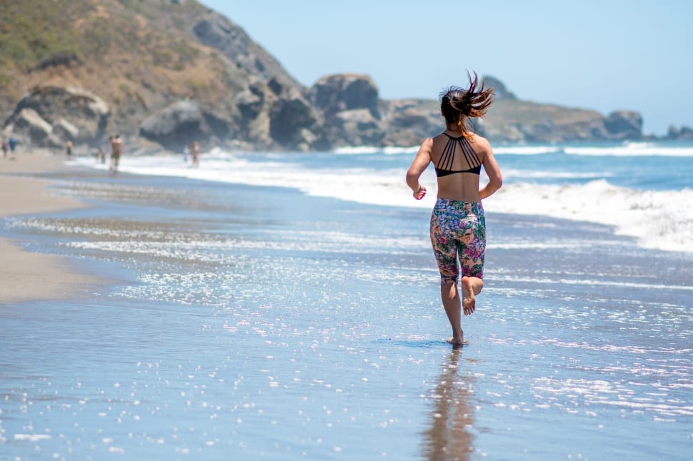woman running near beach shore preview