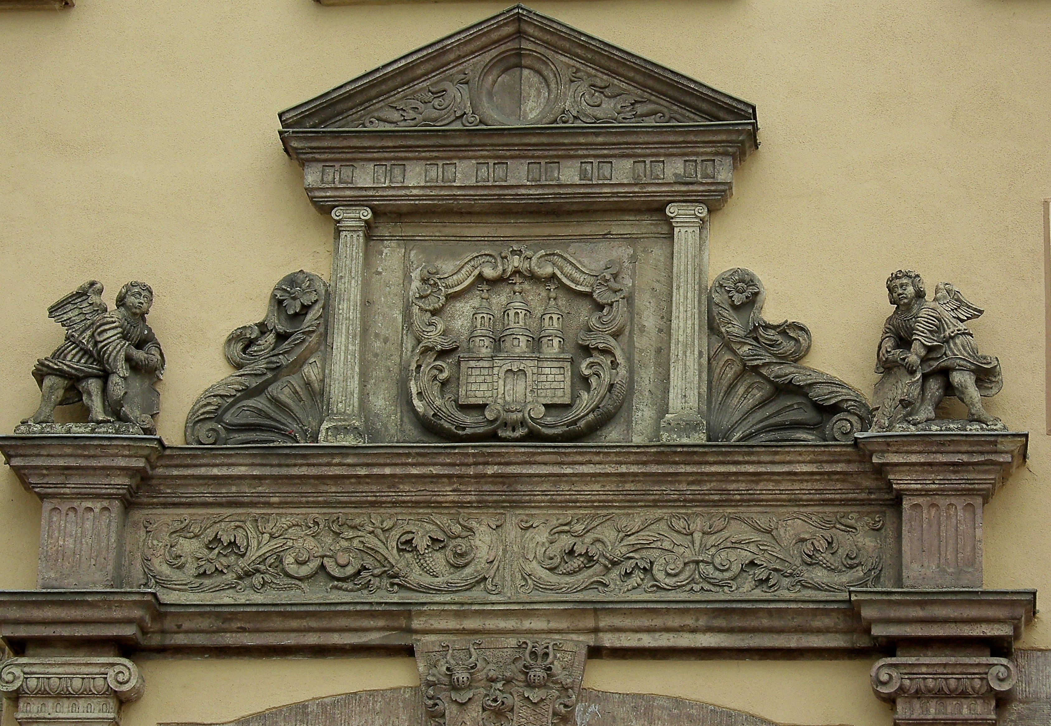 cherub figurines on brown wooden frame