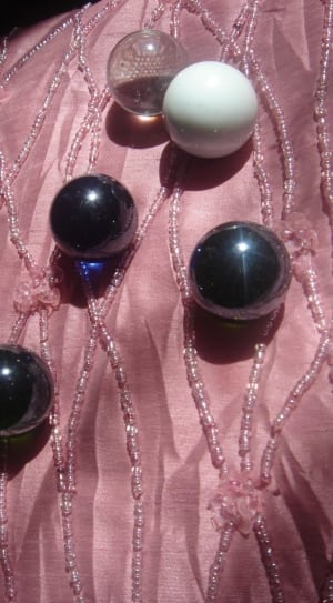 black and white marble balls in brown textile thumbnail