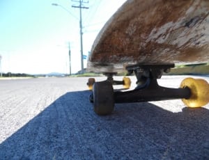 brown skateboard and black trucks thumbnail