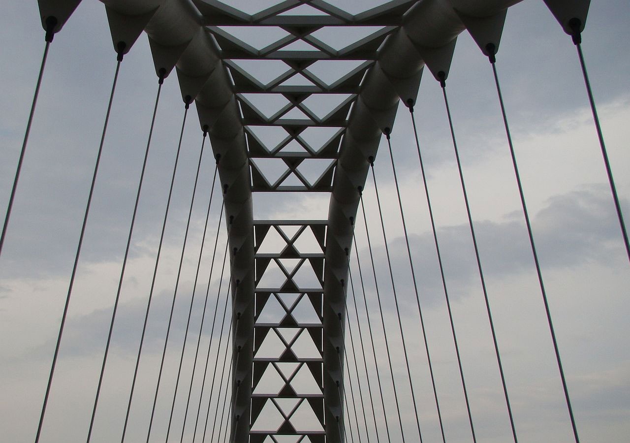 gray steel suspension bridge beams