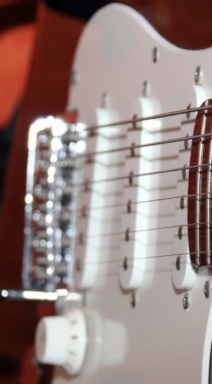 white and brown stratocaster style electric guitar thumbnail