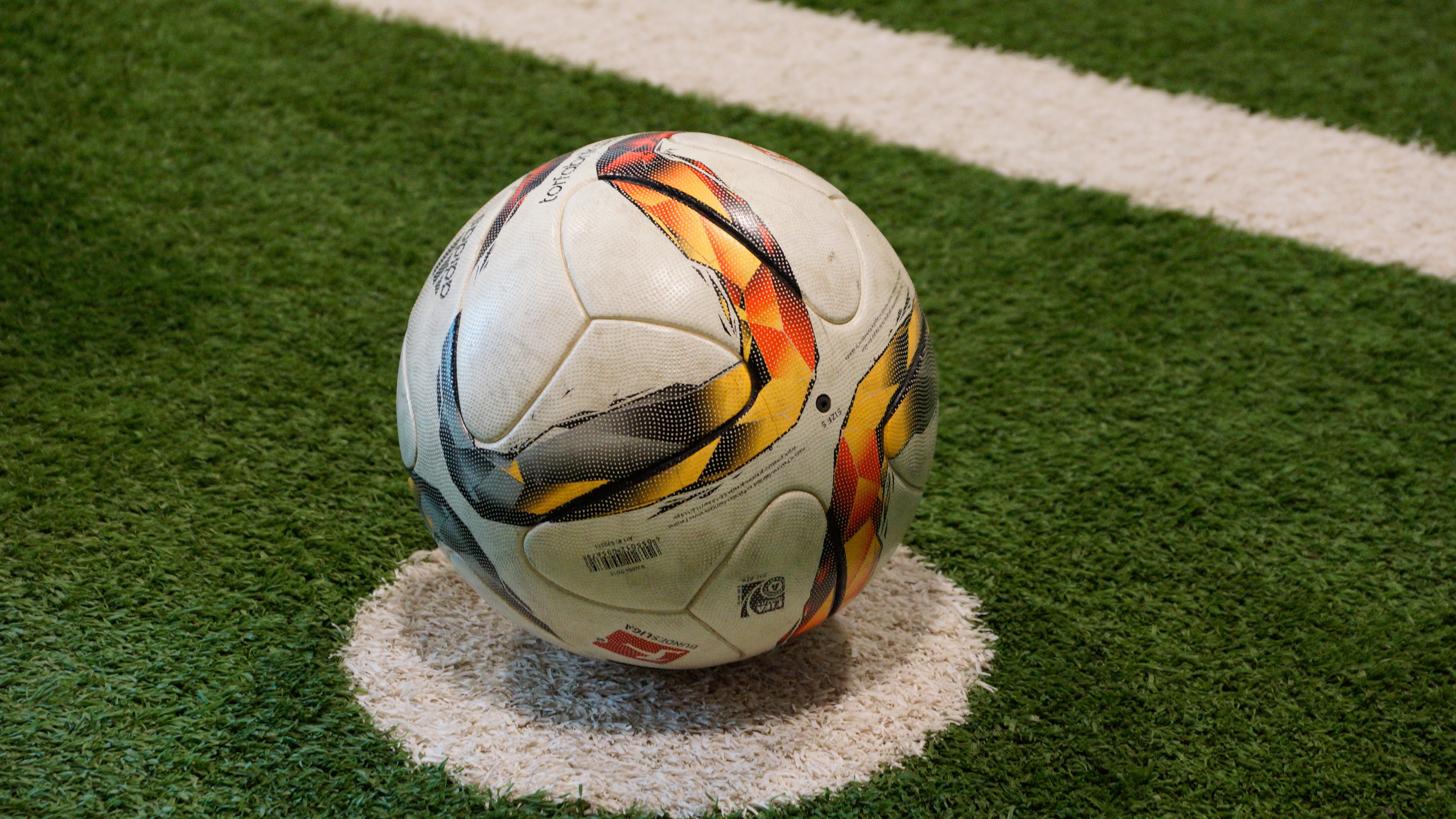 white yellow and red soccer ball