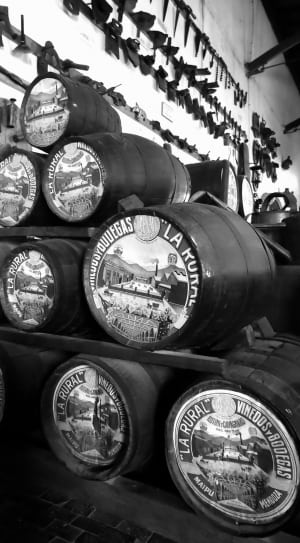 grayscale photography of barrels thumbnail