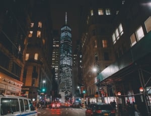 photo of city buildings during night time thumbnail