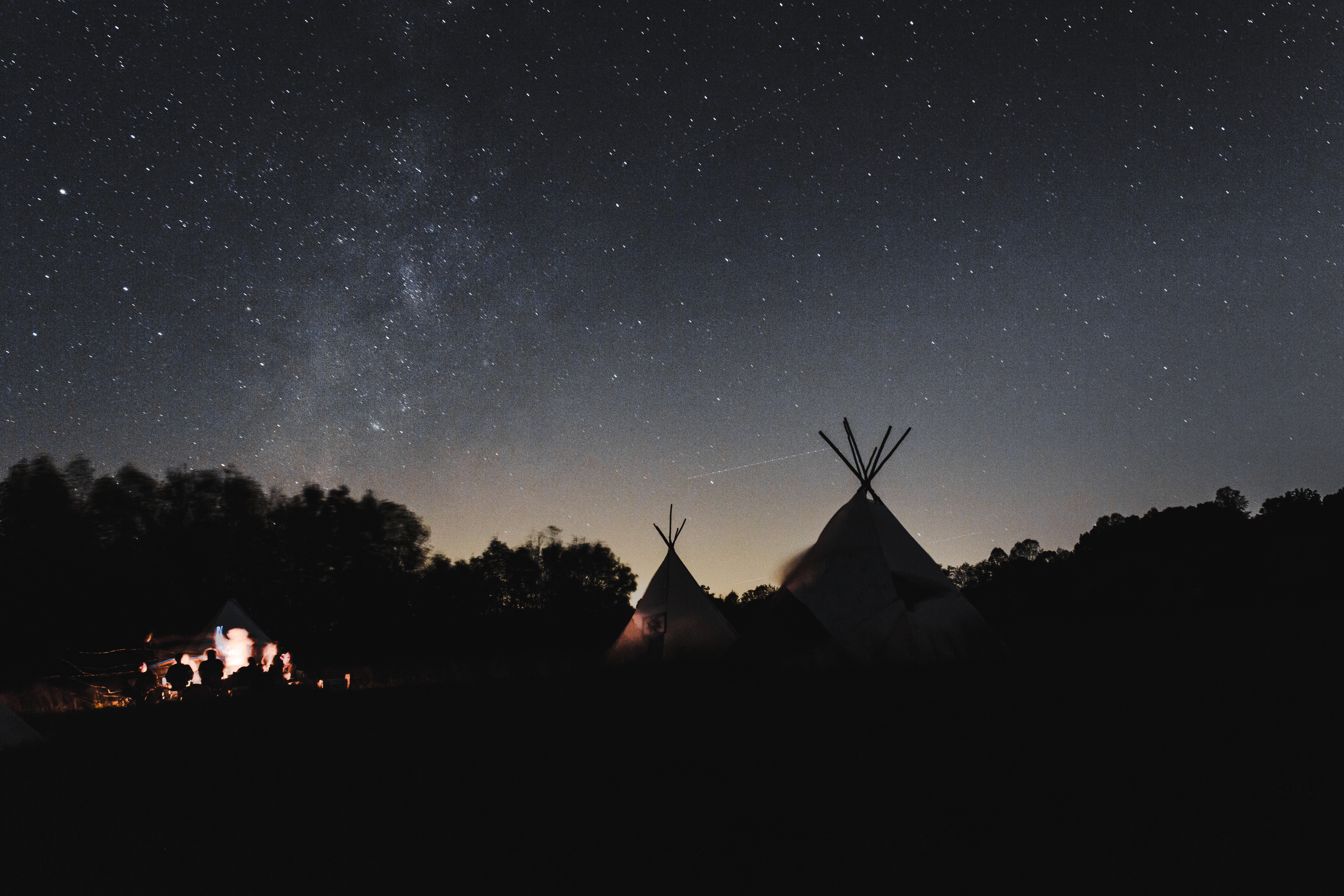 tipi tents on mountain during nighttime