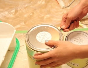 two yellow labeled paint containers thumbnail
