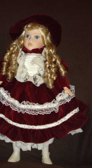 girl wearing red and white long sleeve dress doll thumbnail