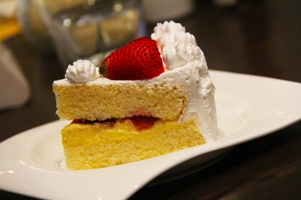 white cake with strawberry tappings preview
