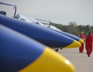 blue yellow fighter jets in row thumbnail
