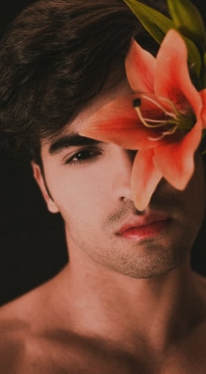 close up photo of person cover flower on his left eye thumbnail
