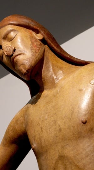 man brown wooden sculpture thumbnail
