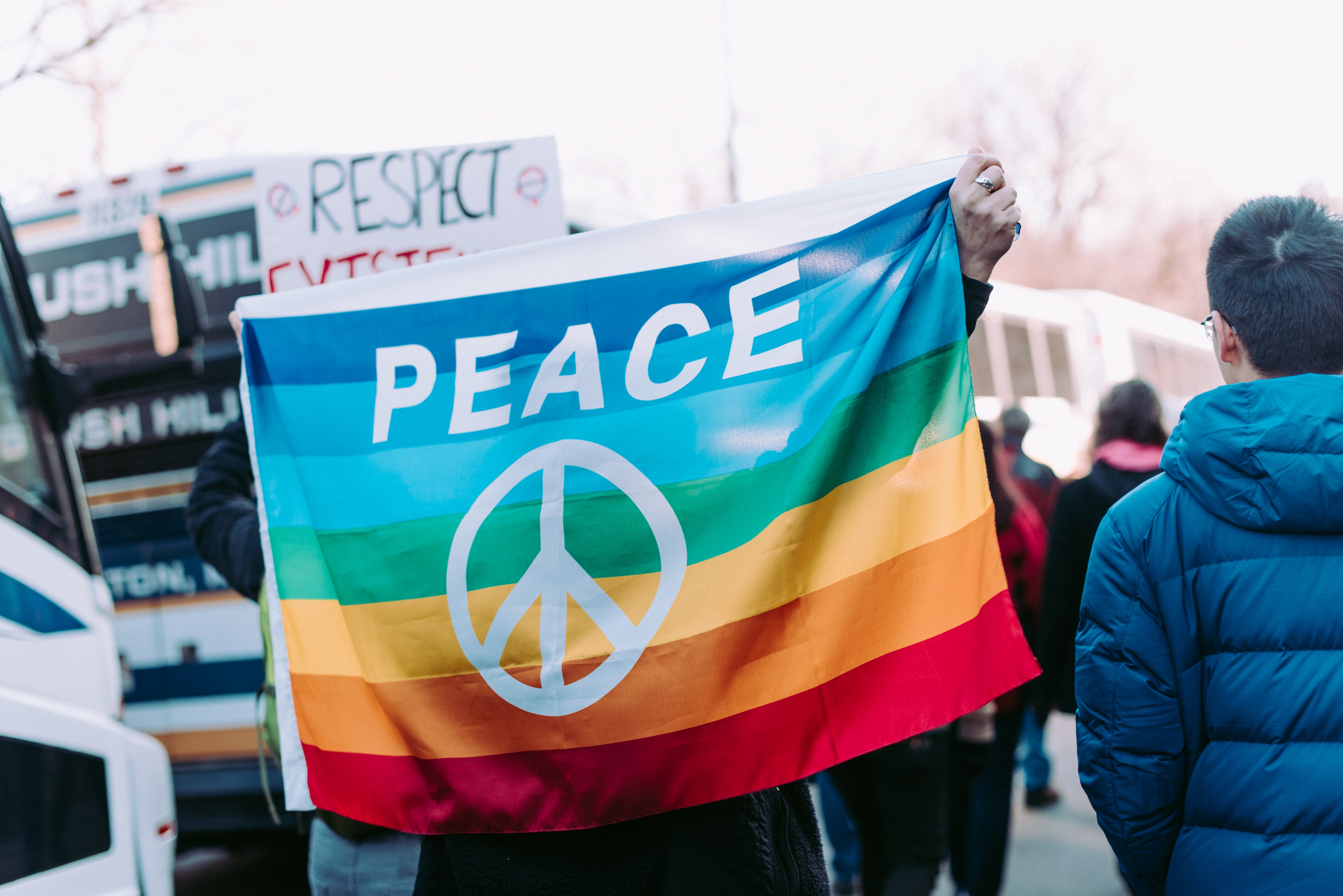 person holding peace banner