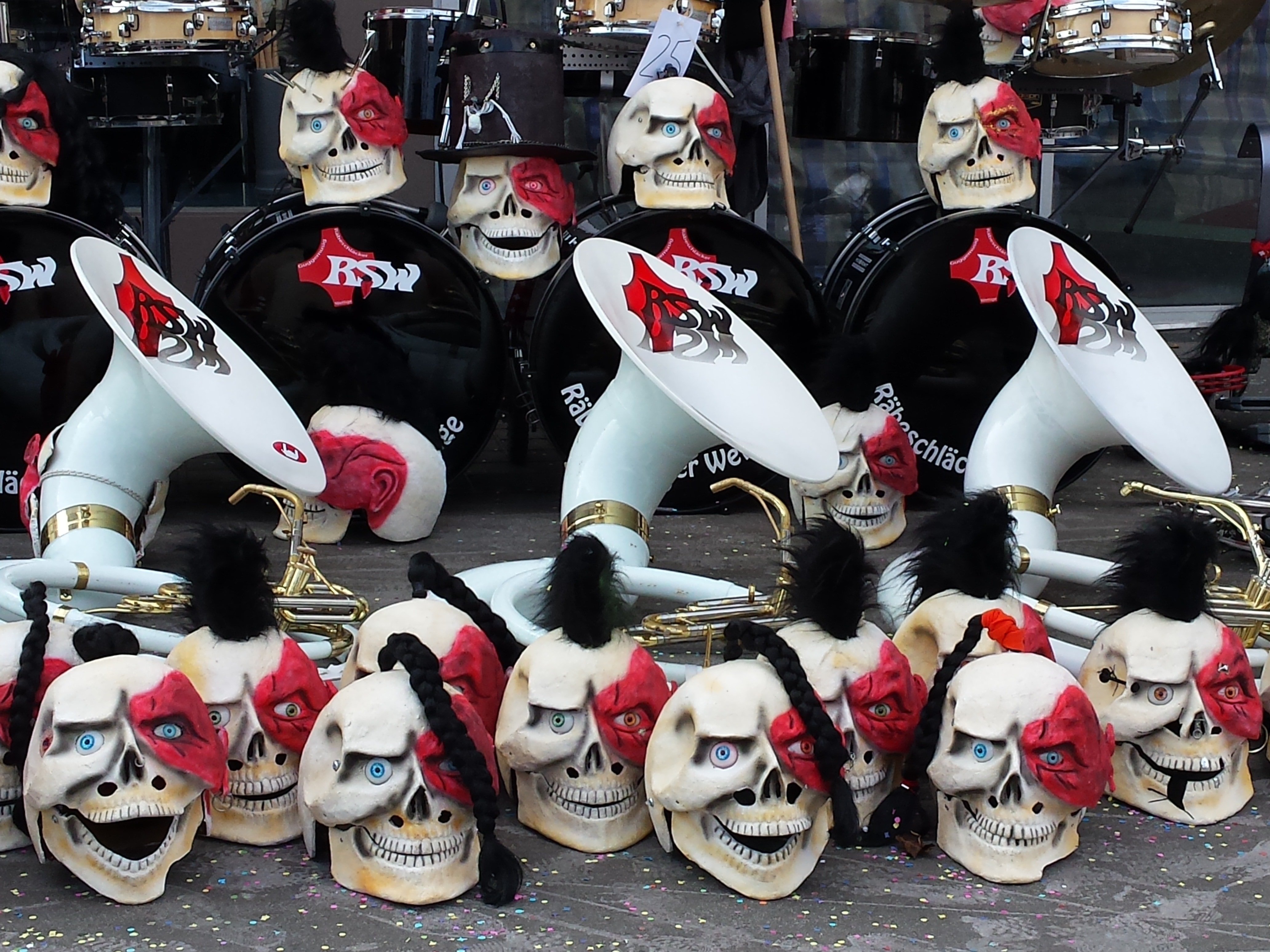 white and red skull helmet and bass drums