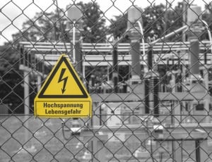 yellow signage on gray fence thumbnail