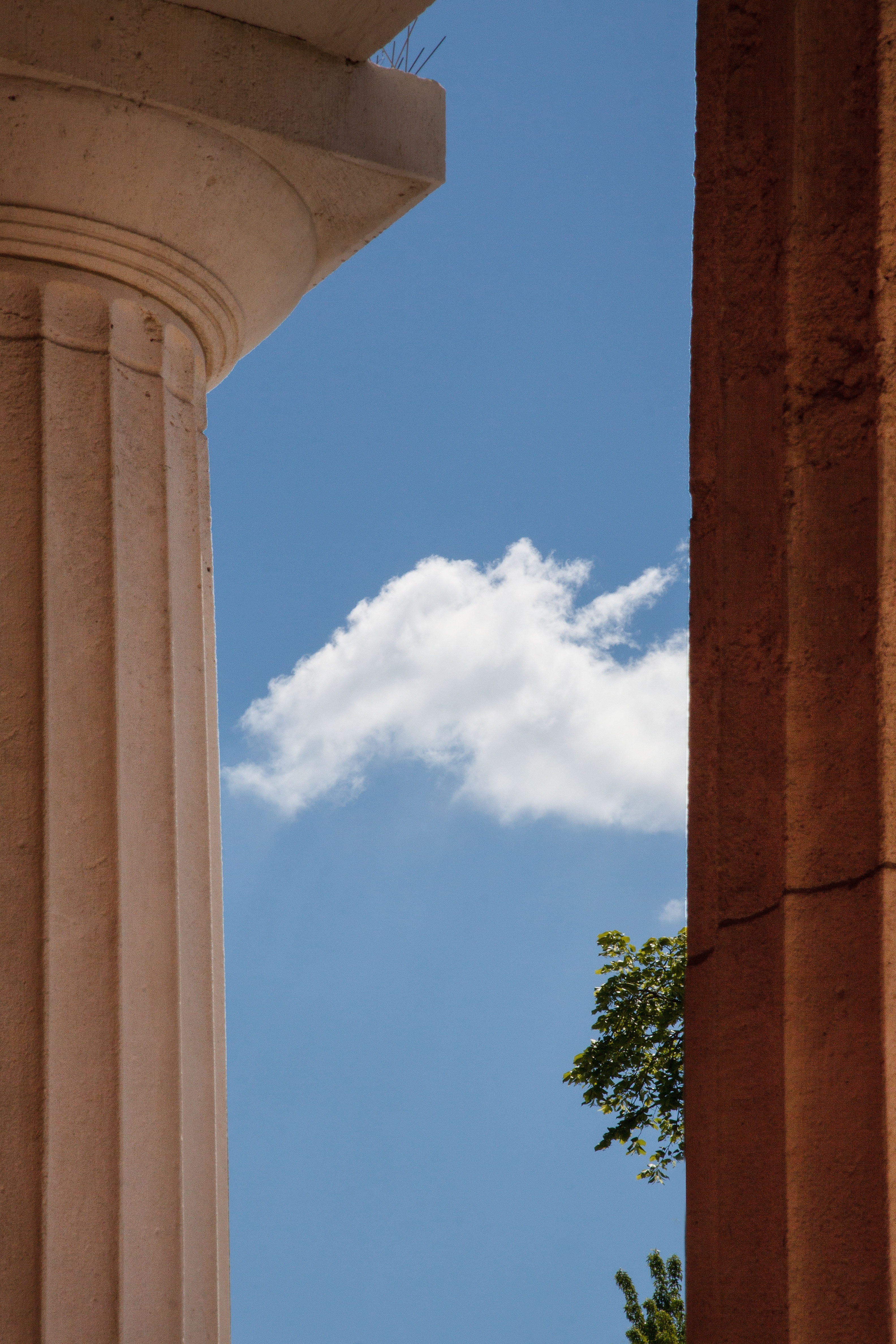 white concrete greek pillar