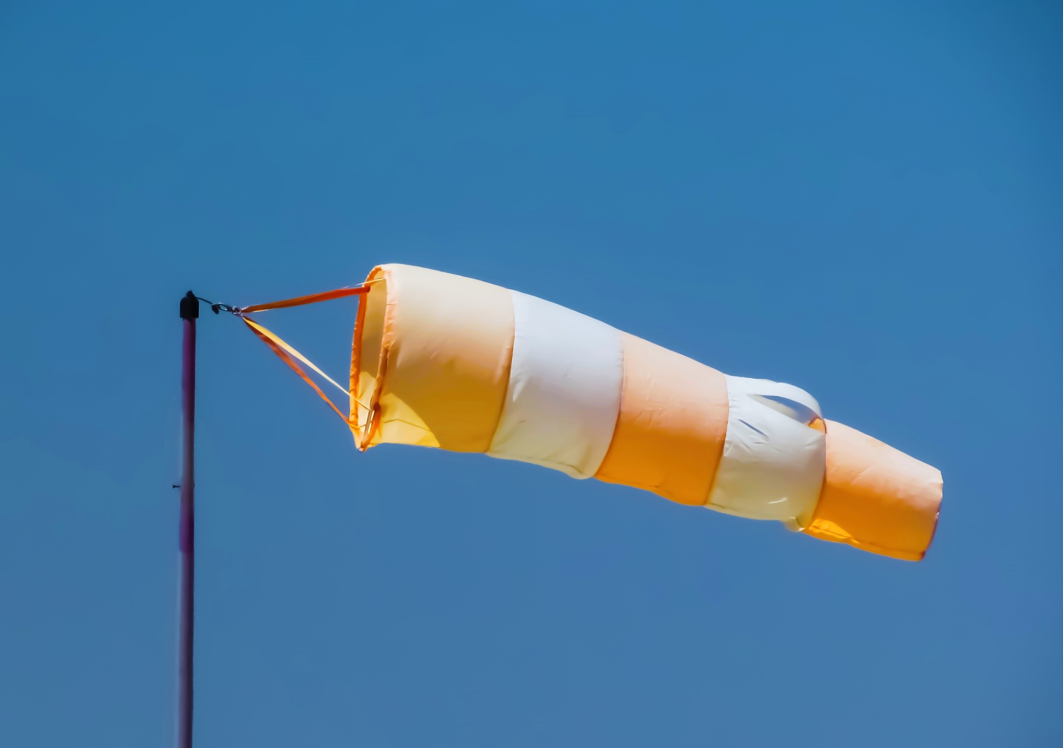 orange and white pole kite